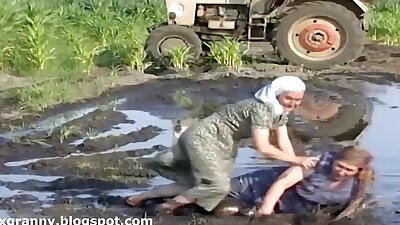 Grandmas wrestle in the mud